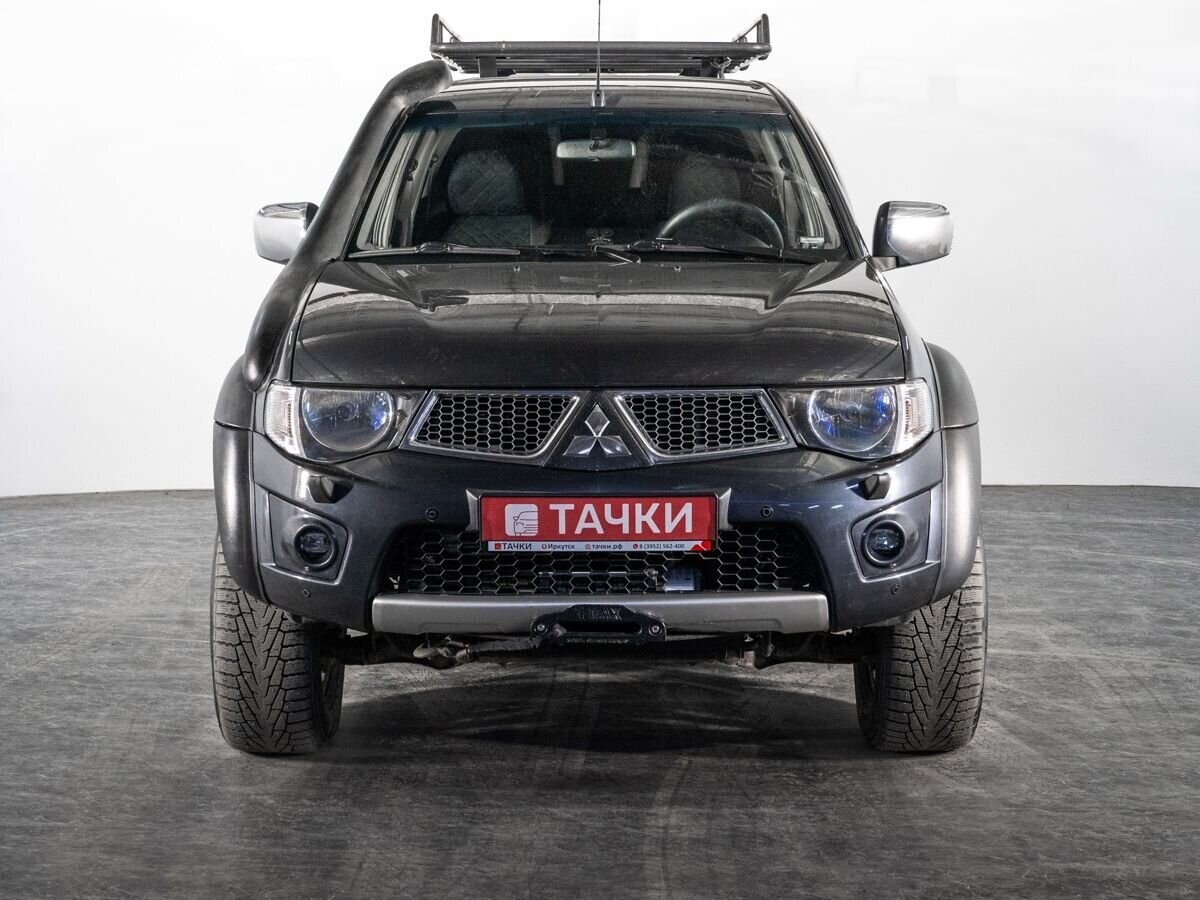 Mitsubishi L200 2010 - фото автомобиля
