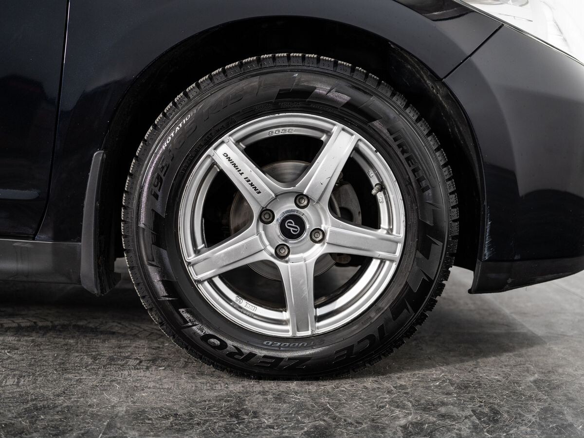 Nissan Tiida 2009 - фото автомобиля