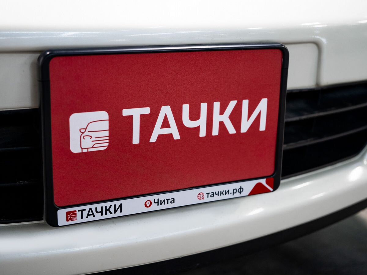 Nissan Tiida 2010 - фото автомобиля